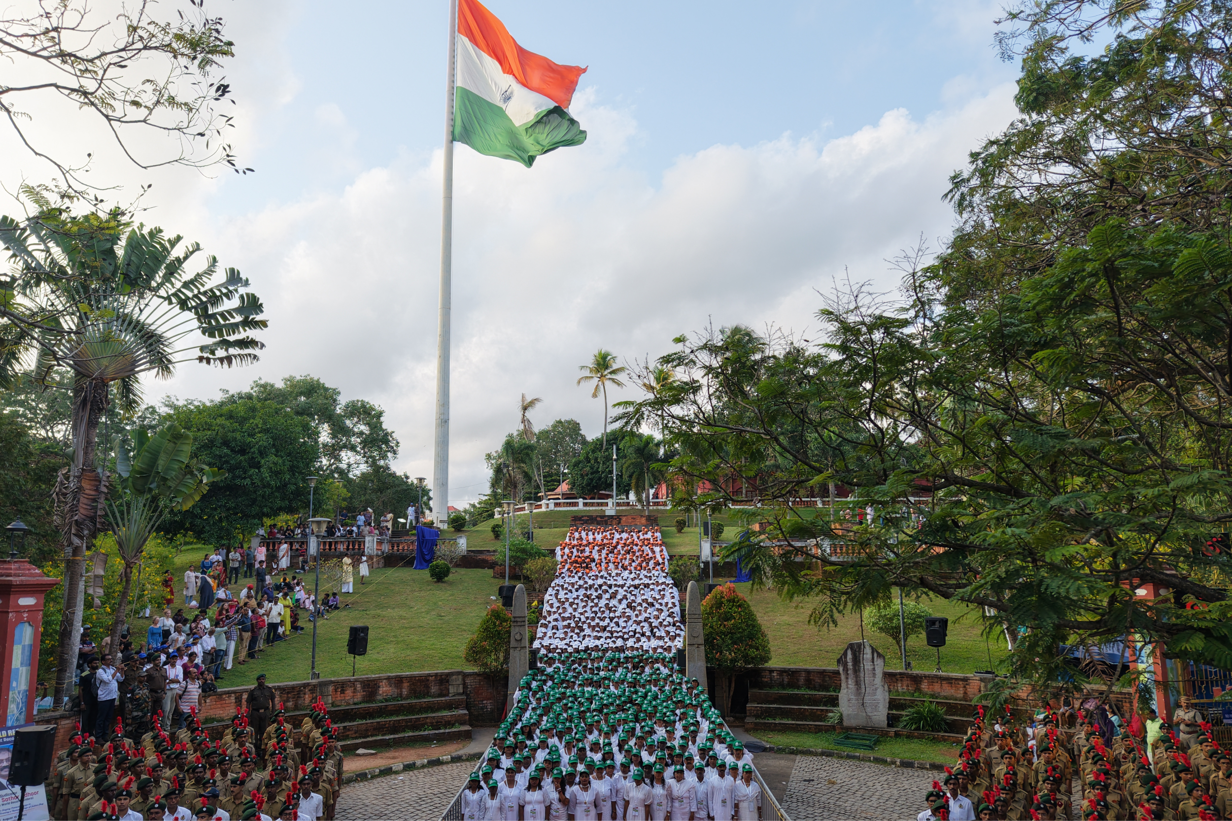 PAATTINTE KOOTTUKAAR - MOST PEOPLE SINGING PATRIOTIC SONGS IN THE SAME ATTIRE WHILE FORMING A HUMAN IMAGE OF THE INDIAN FLAG